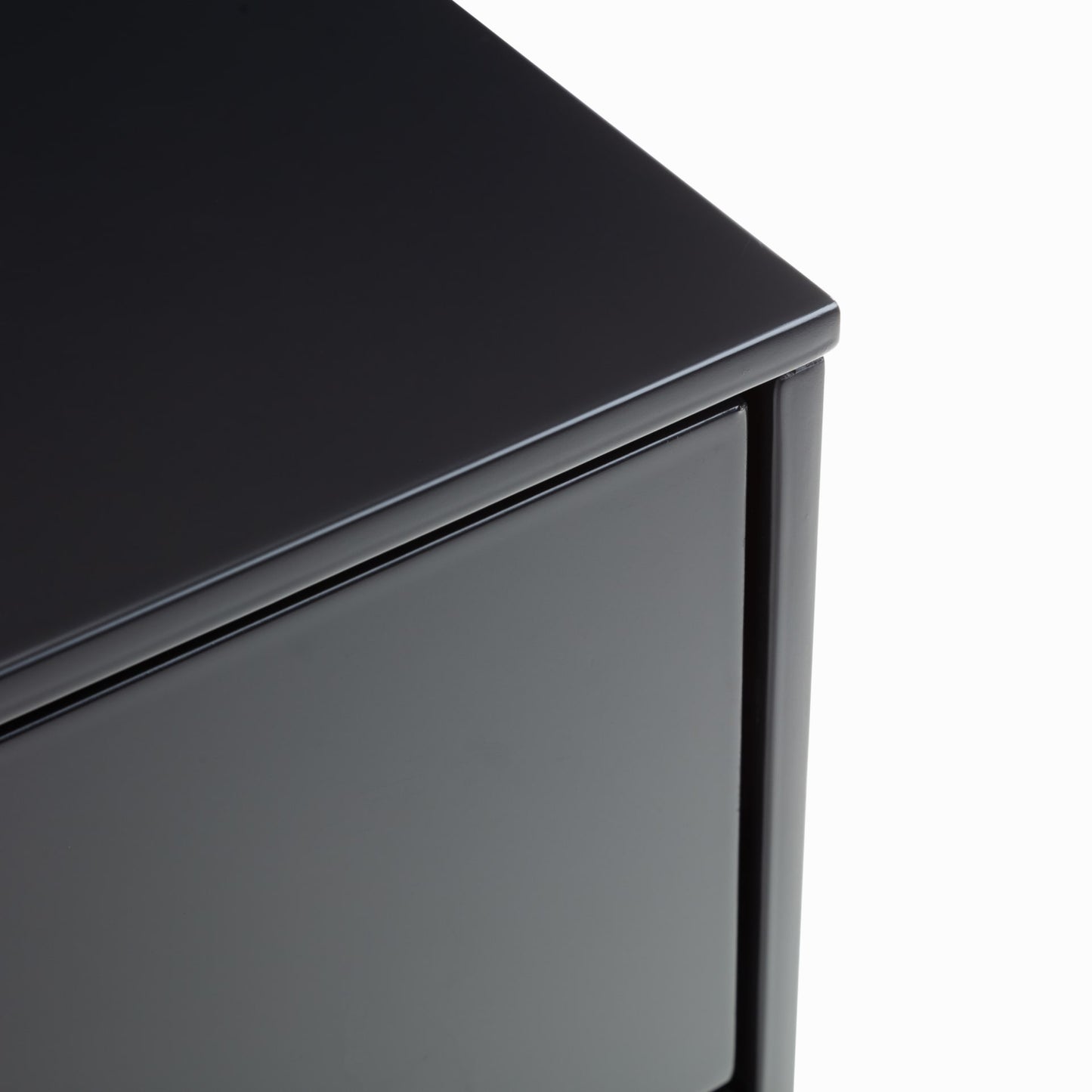 Close view of the top, edges and finishes of the charcoal lacquered bedside table