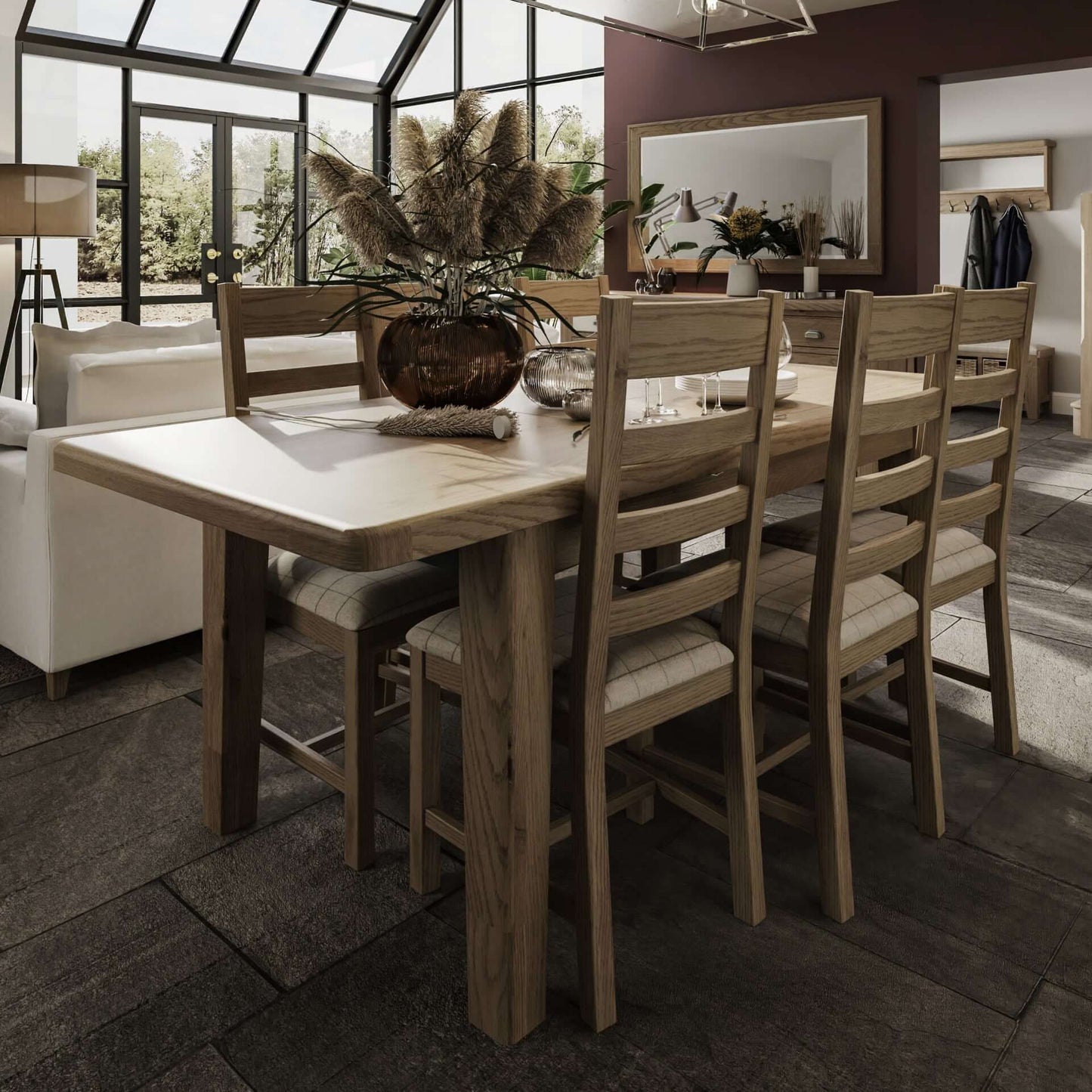 1.8m Oak Extending Dining Table. Set with slated chairs around and beautiful table set up with a vase and tableware 