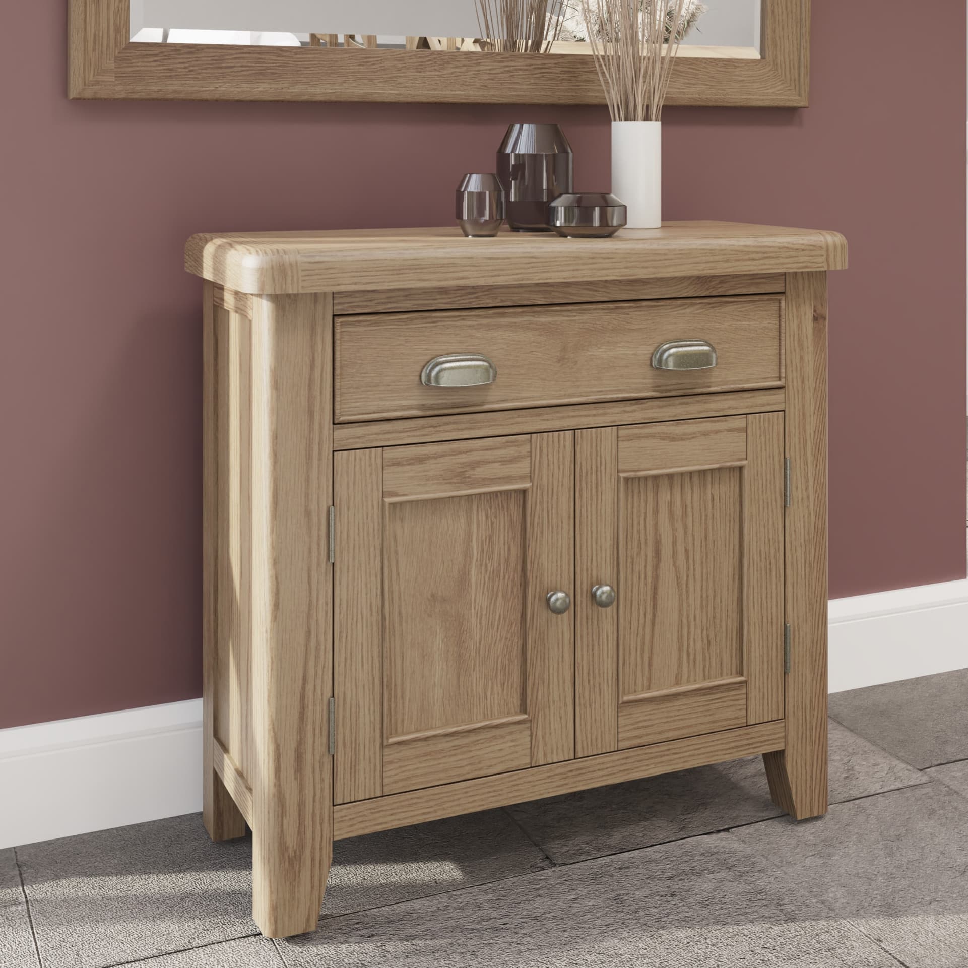 1 drawer 2 door oak sideboard shown in a life setting with decor on top