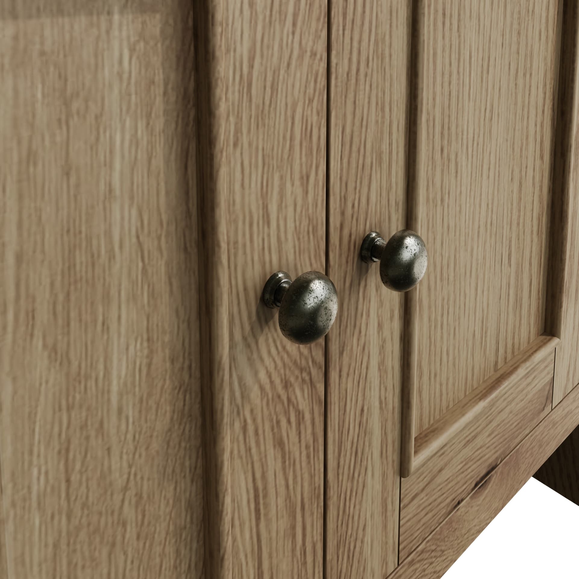 Close view on door decor and round handles in antique finish of the small sideboard