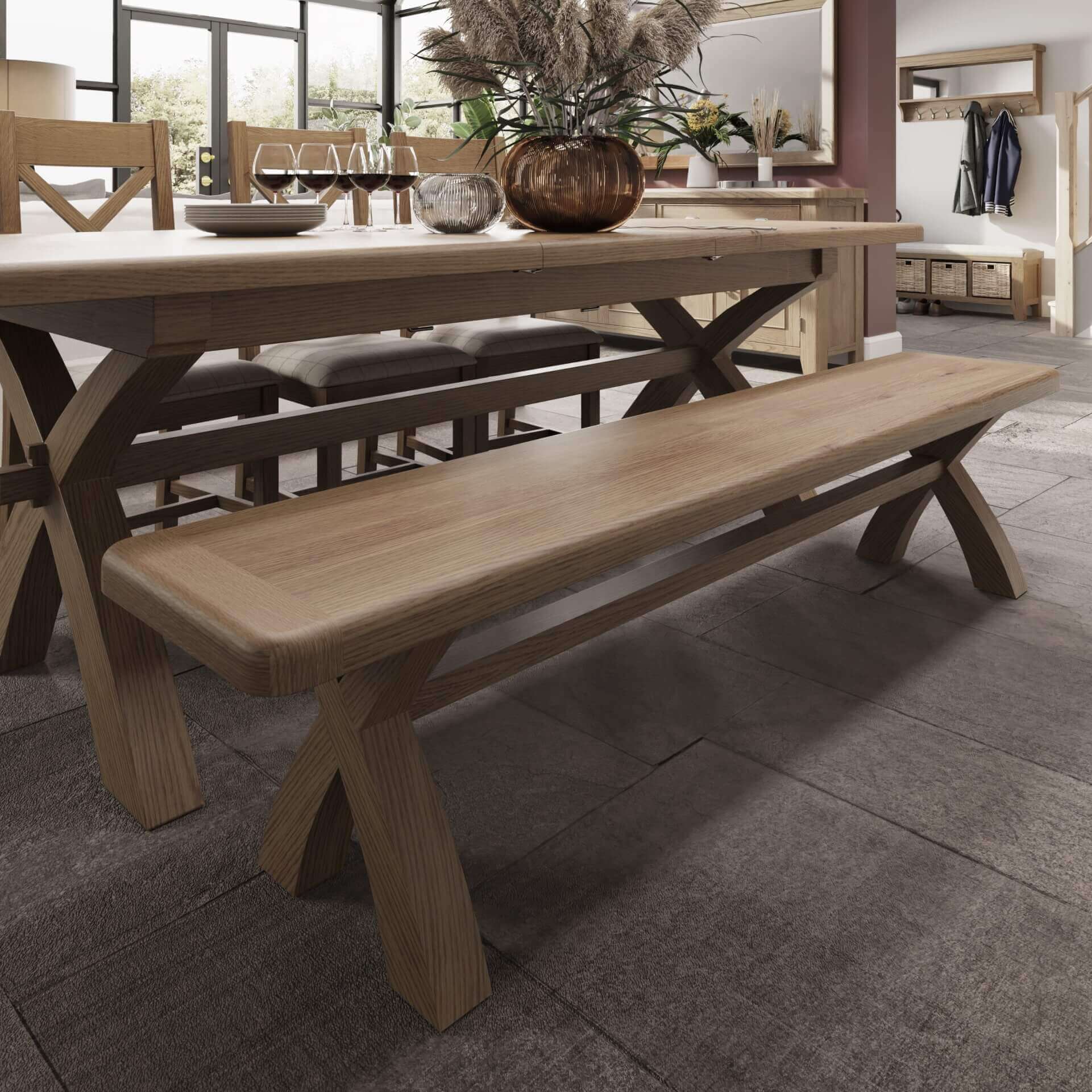 Trestle oak 2m dining bench shown in dining room setting next to trestle dining table 