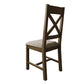 Back side view on cross back dining chair in smoked oak colour and with beige padded seat