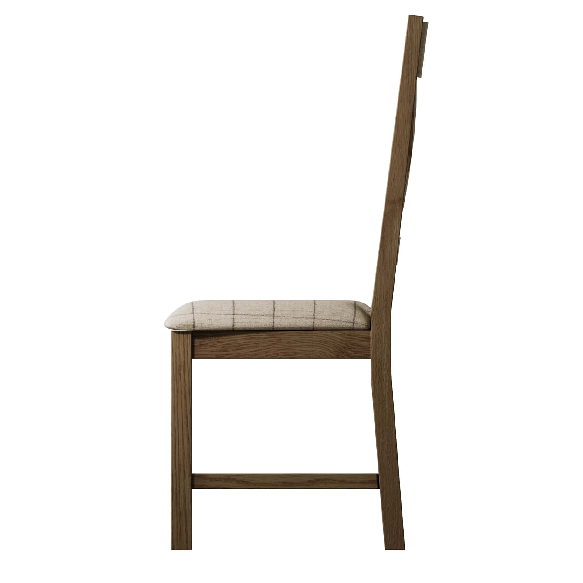 Side view on oak dining chair with beige padded seat