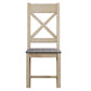 Front view on cross back dining chair with grey padded seat