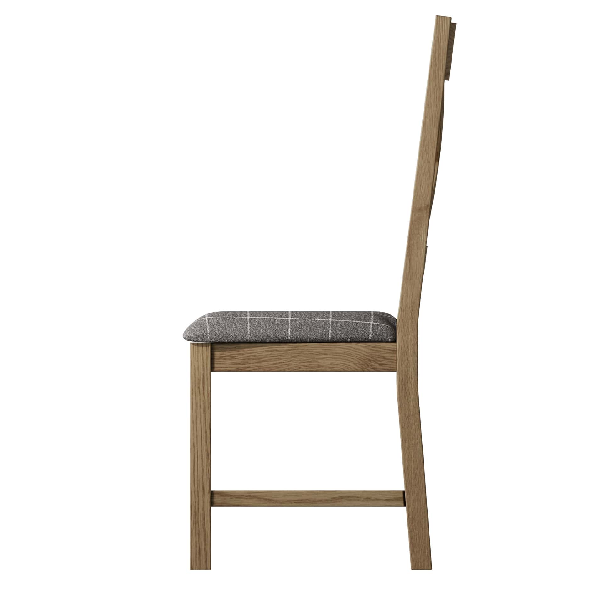 Side view on oak dining chair with grey padded seat