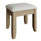 Oak vanity stool is shown separately without distractions at an angle