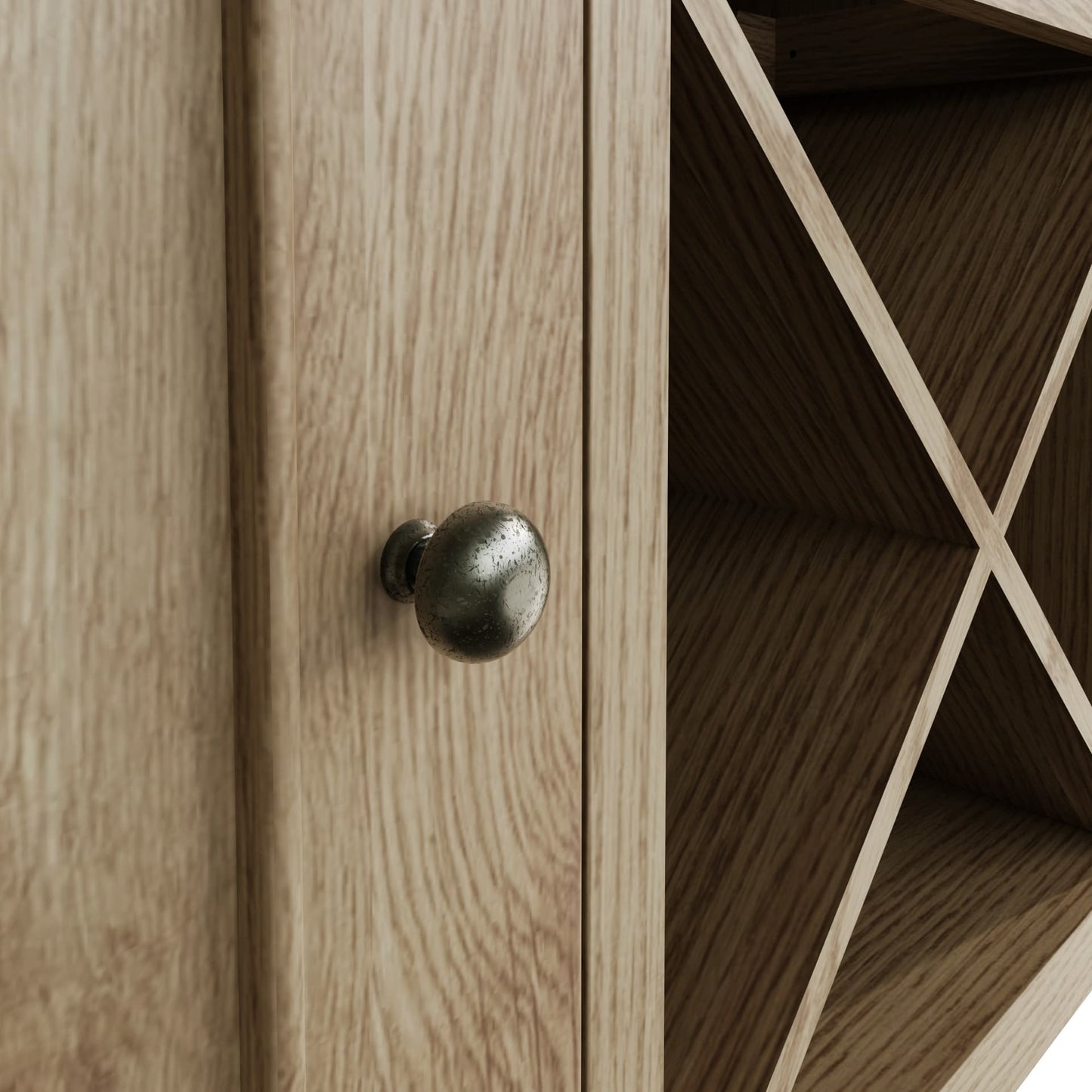 Close view on door handles, cupboard door decor and wine rack of large oak sideboard