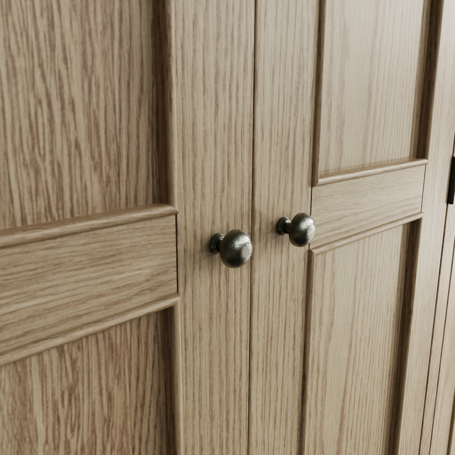 Close view on knob handles of the 3 door wardrobe with antique effect