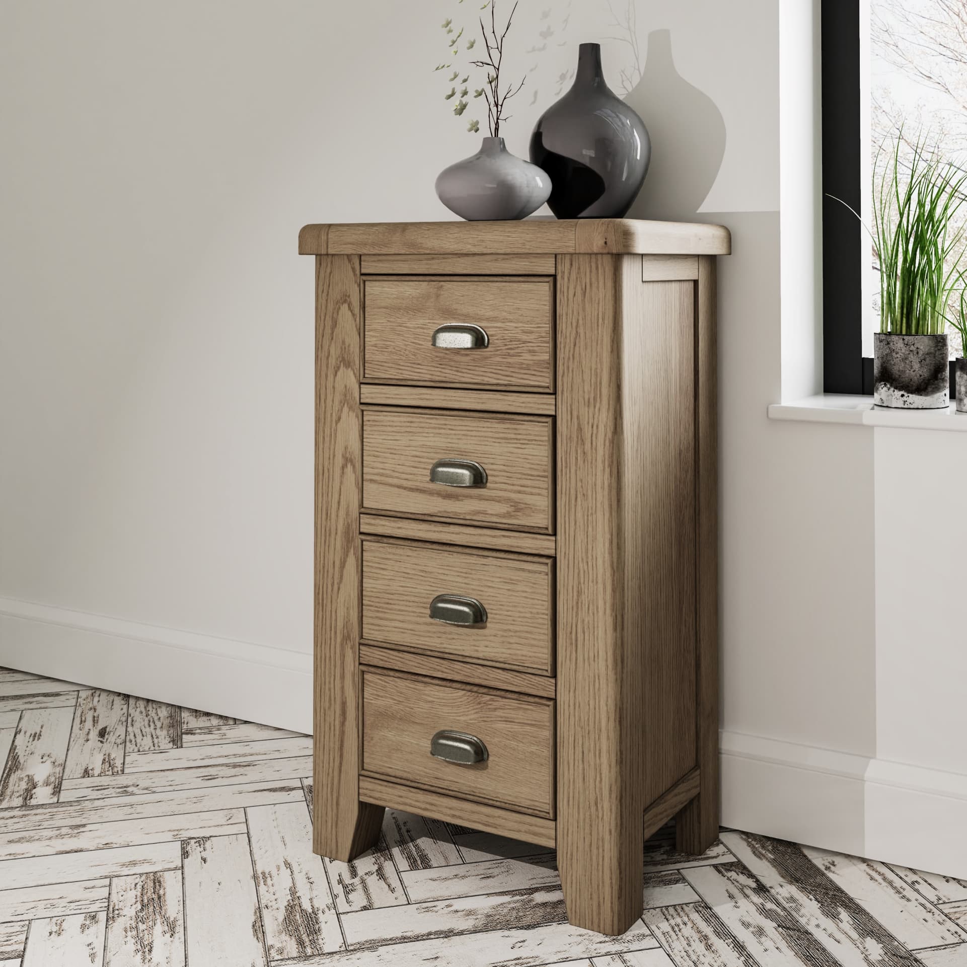 Oak 4 drawer chest is shown in a room setting with decor on top