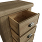 Close view on open drawers and cup handles with antique effect of the narrow oak chest of drawers 