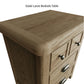 Close view on rounded edges and corners and finishes of the large wooden bedside table