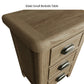 Close view on rounded edges and corners and finishes of the small wooden bedside table