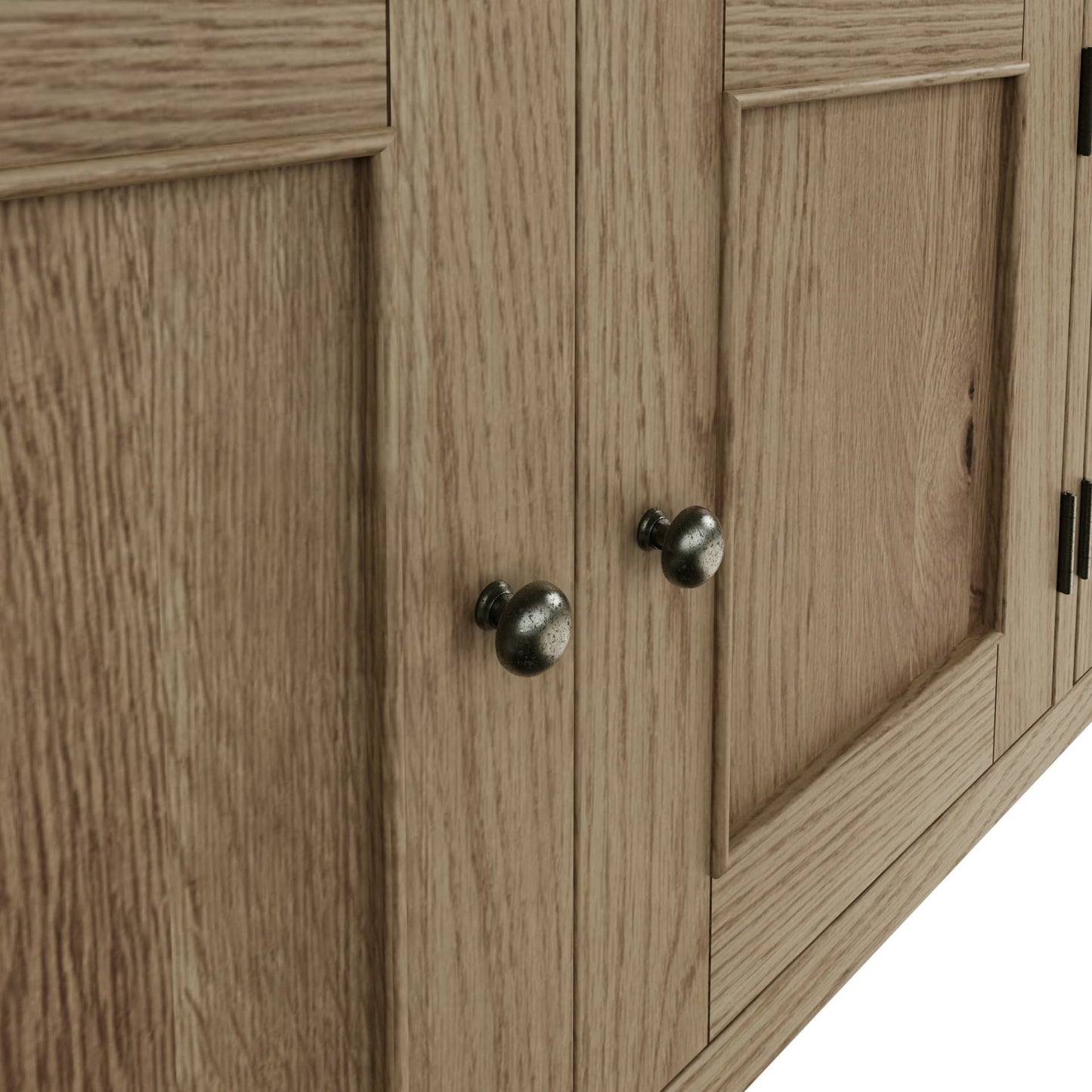 Close view on door handles and door decor of the cabinets of the large oak sideboard