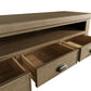 Inside of the open drawers of the oak TV stand