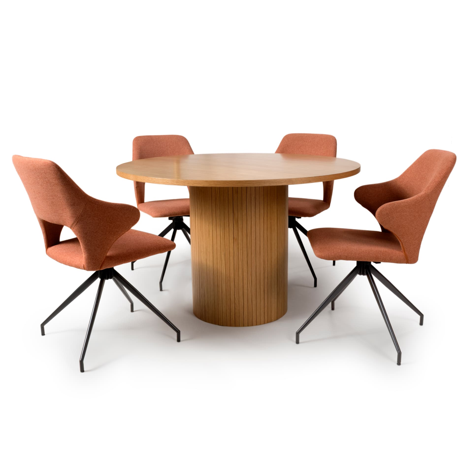 Round oak dining table with 4 red chairs on white background