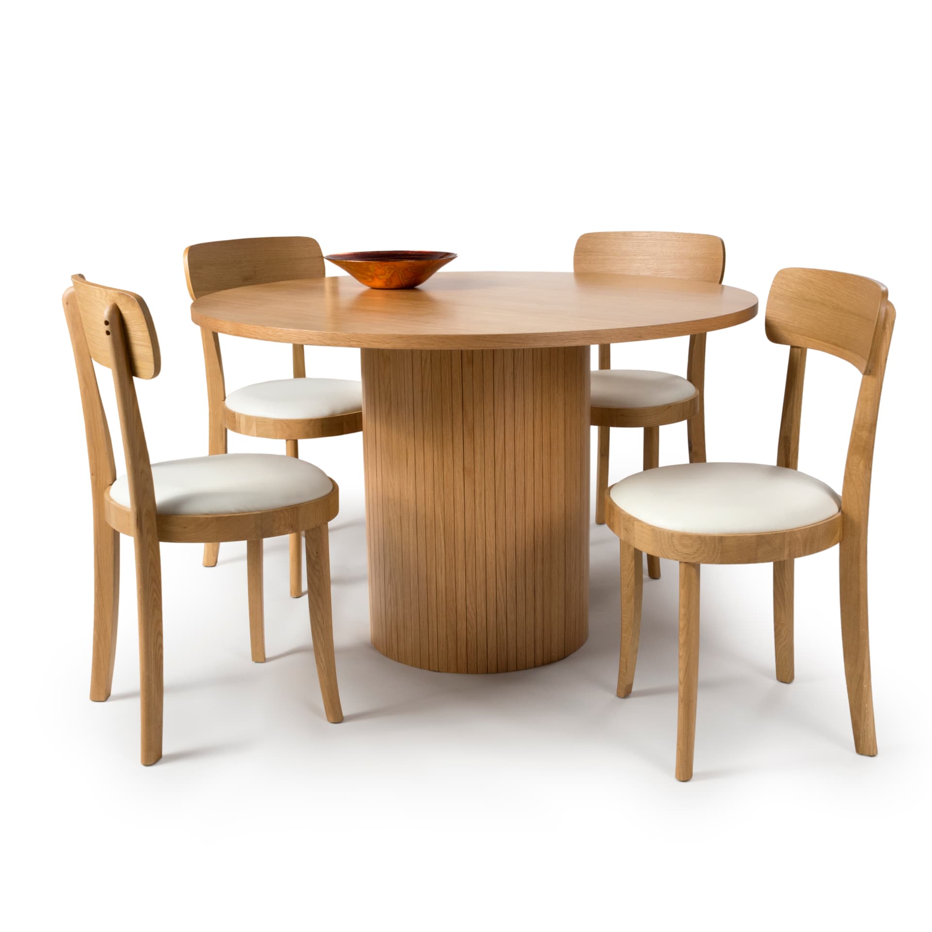 Small round dining table with 4 white chairs and a prop bowl on a white background  