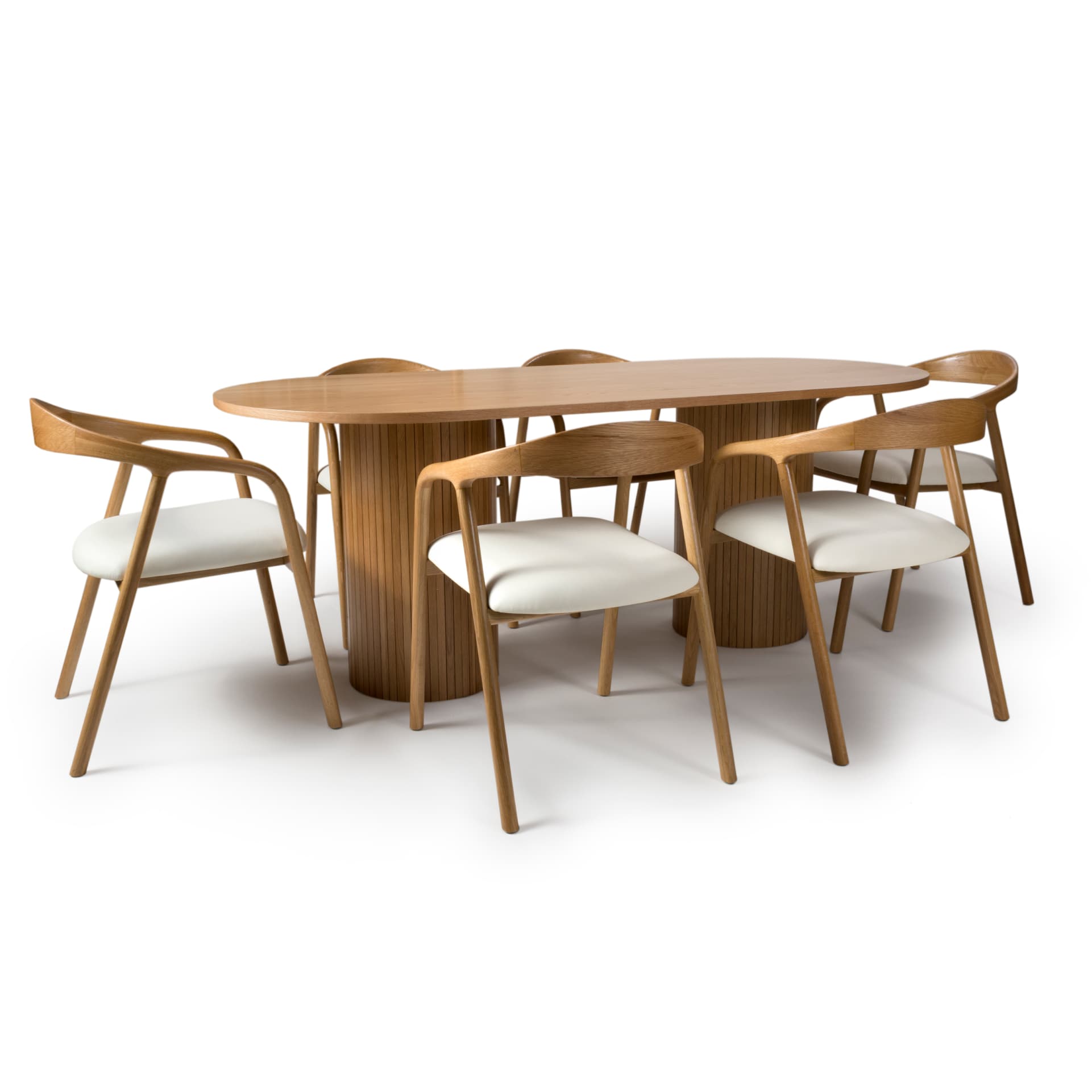 oval oak dining table with slatted pedestal legs is shown with 6 contemporary chairs
