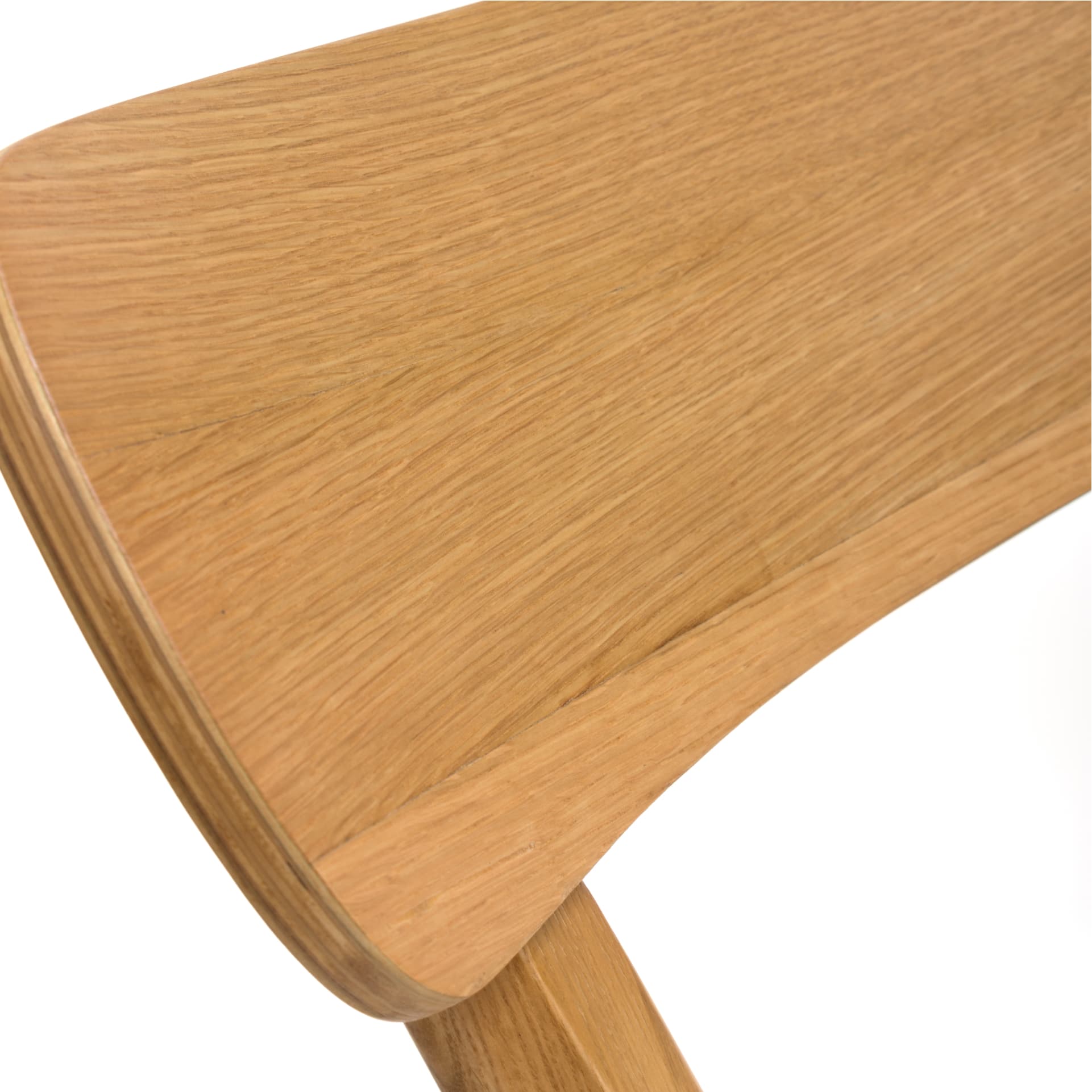 close look on curved back of an oak dining chair