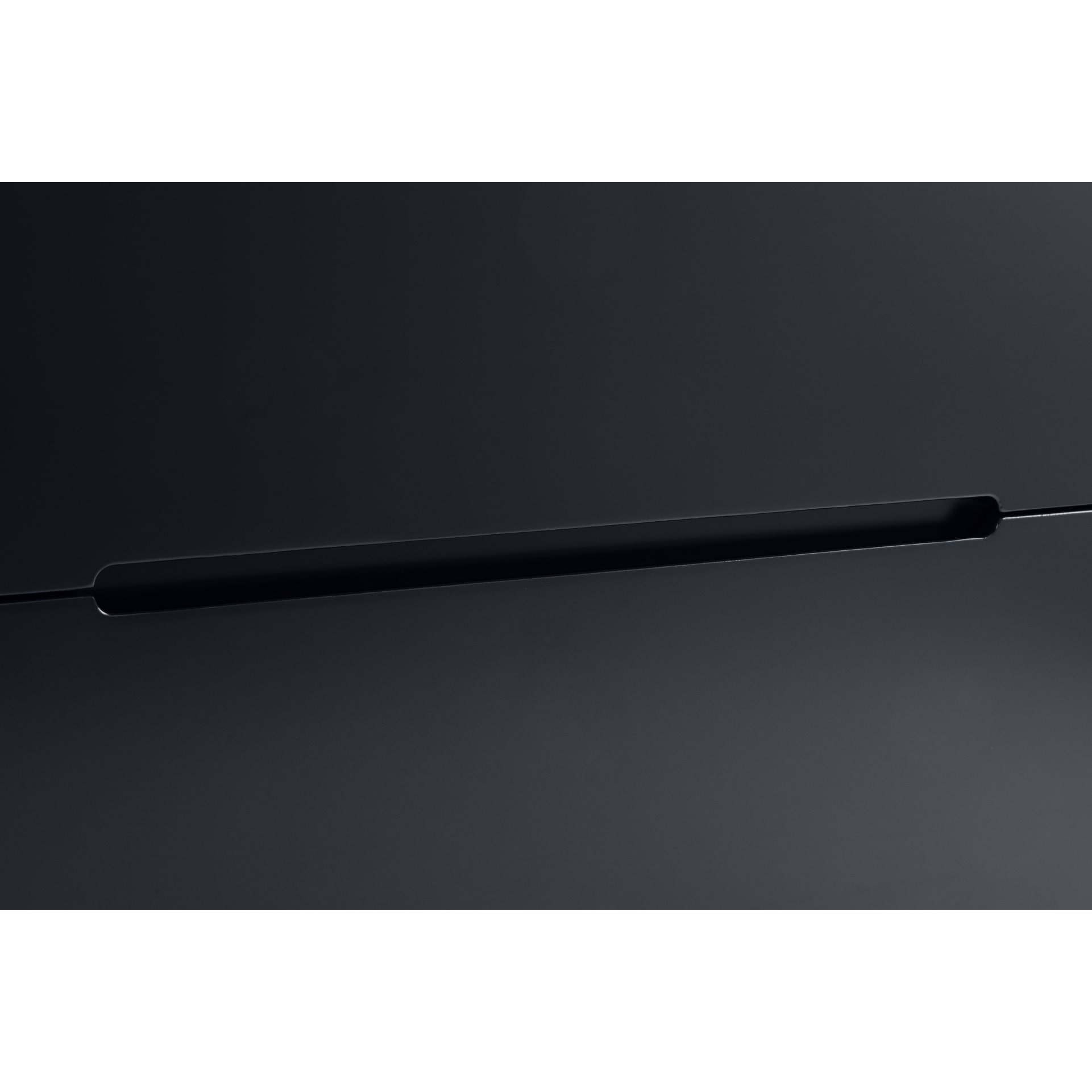 close look on recessed handles of the drawers at the bottom of the wardrobe