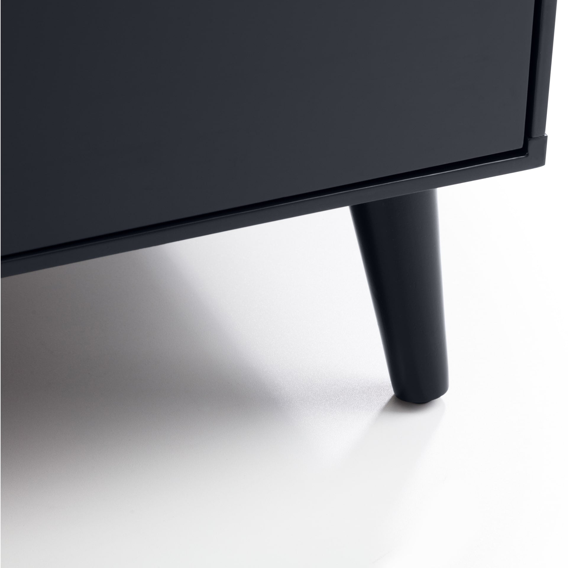 Close look on one of the legs of the black charcoal wardrobe