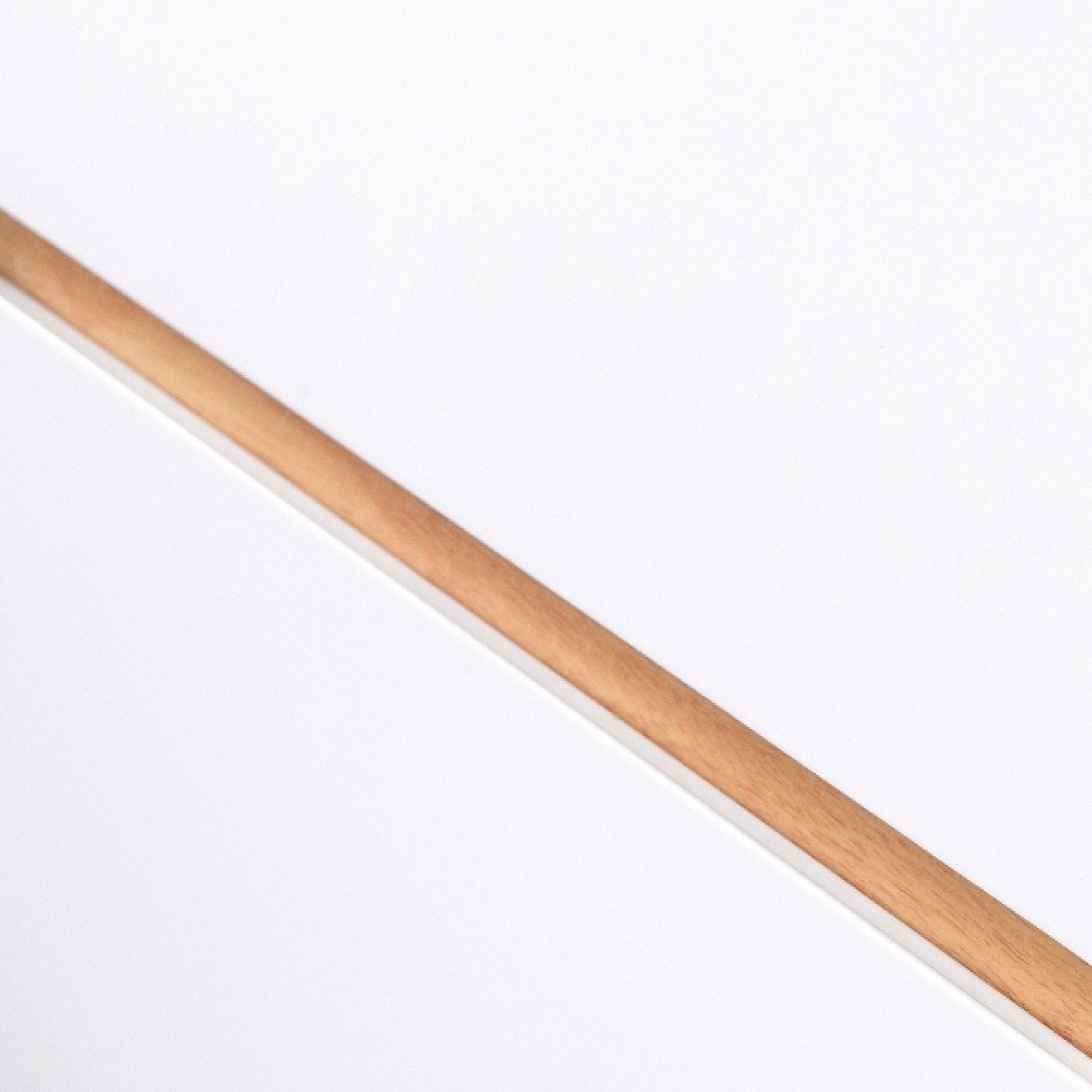 close look at recessed handle. Combination of white drawers and oak coloured contrasting recessed handle