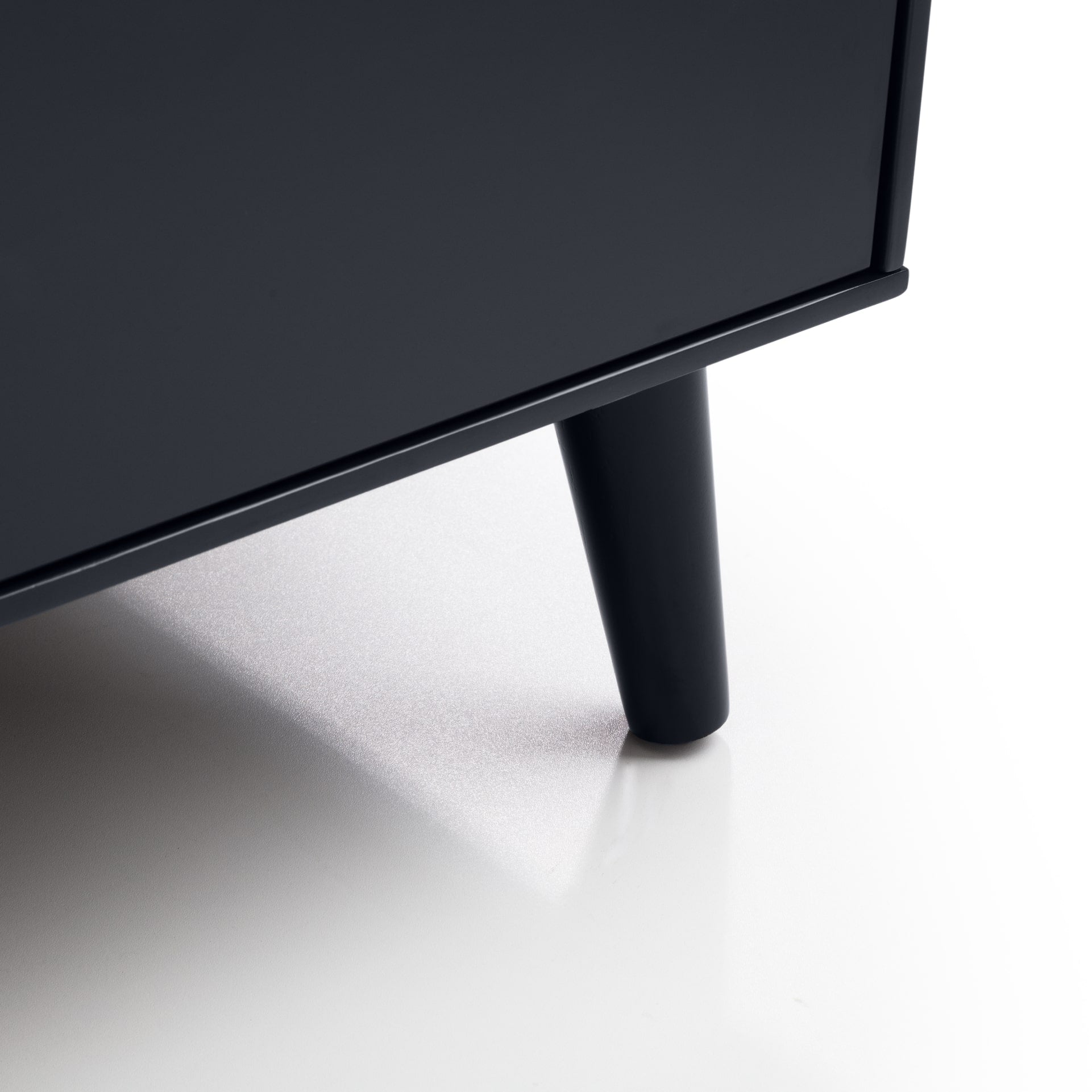 Close look at dresser tapered leg in black