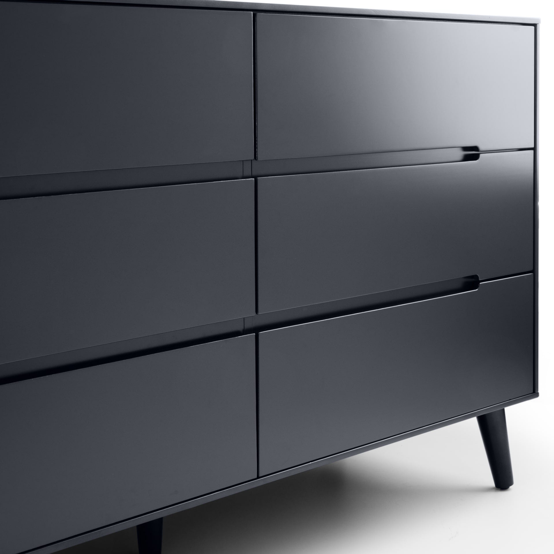 Close look on recessed handles and finishes of anthracite black wide 6 drawer dresser