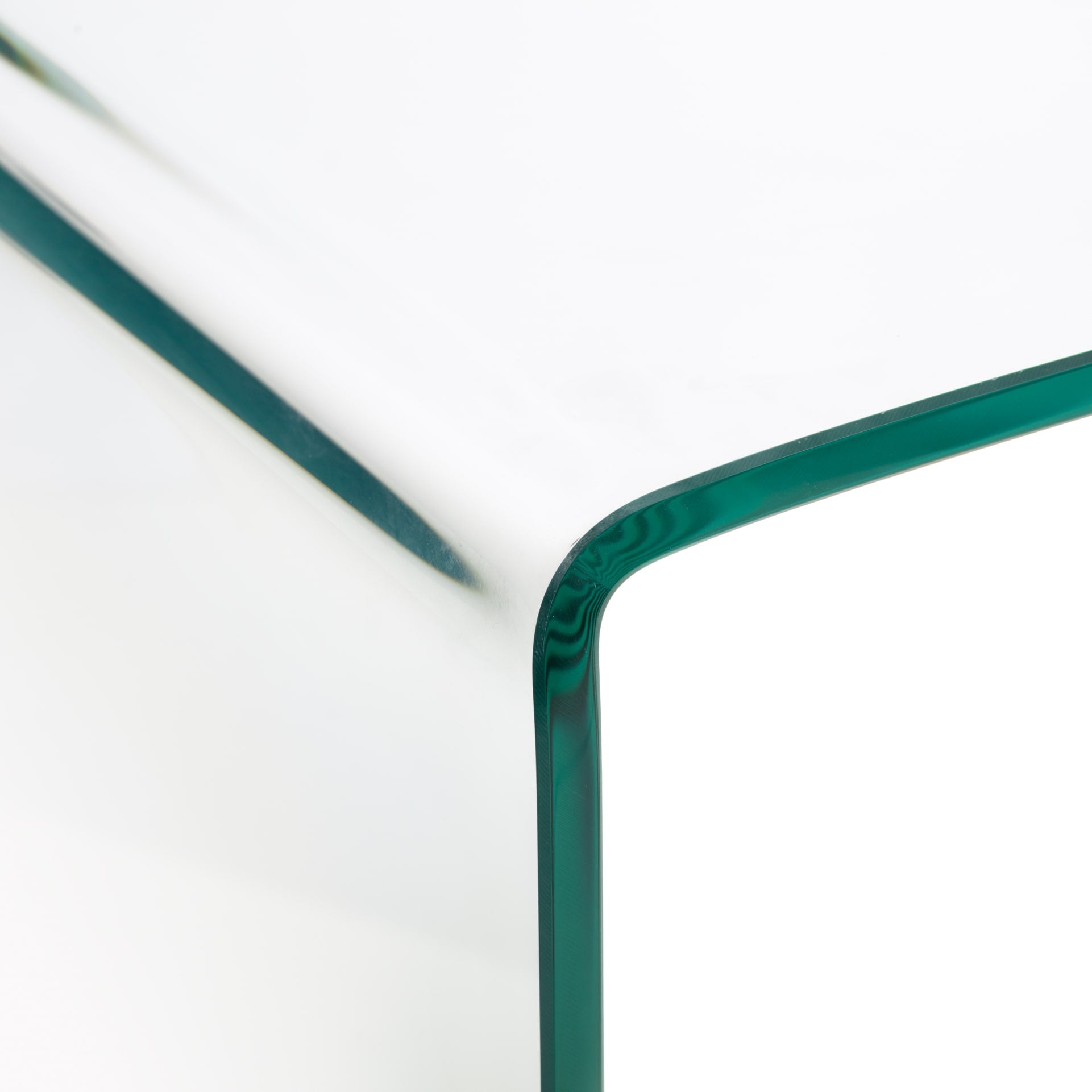 Close look on curving edge of the tempered glass hallway table 