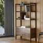 Wooden display unit with shelving and a 2 door cupboard in the room setting with decor