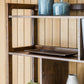 Zoom on wooden shelves of the display unit with decor