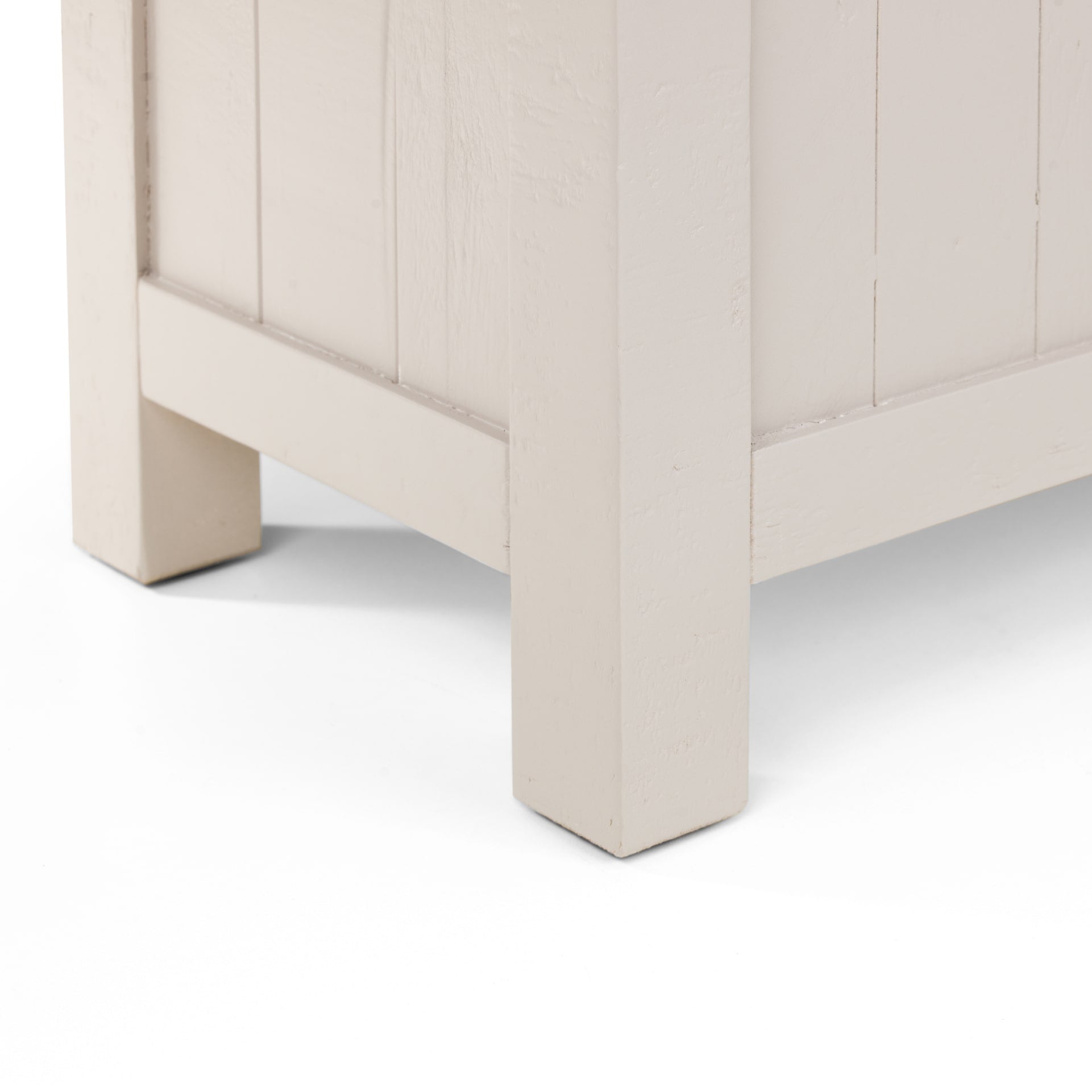 Close look on painted legs of the grey storage bench