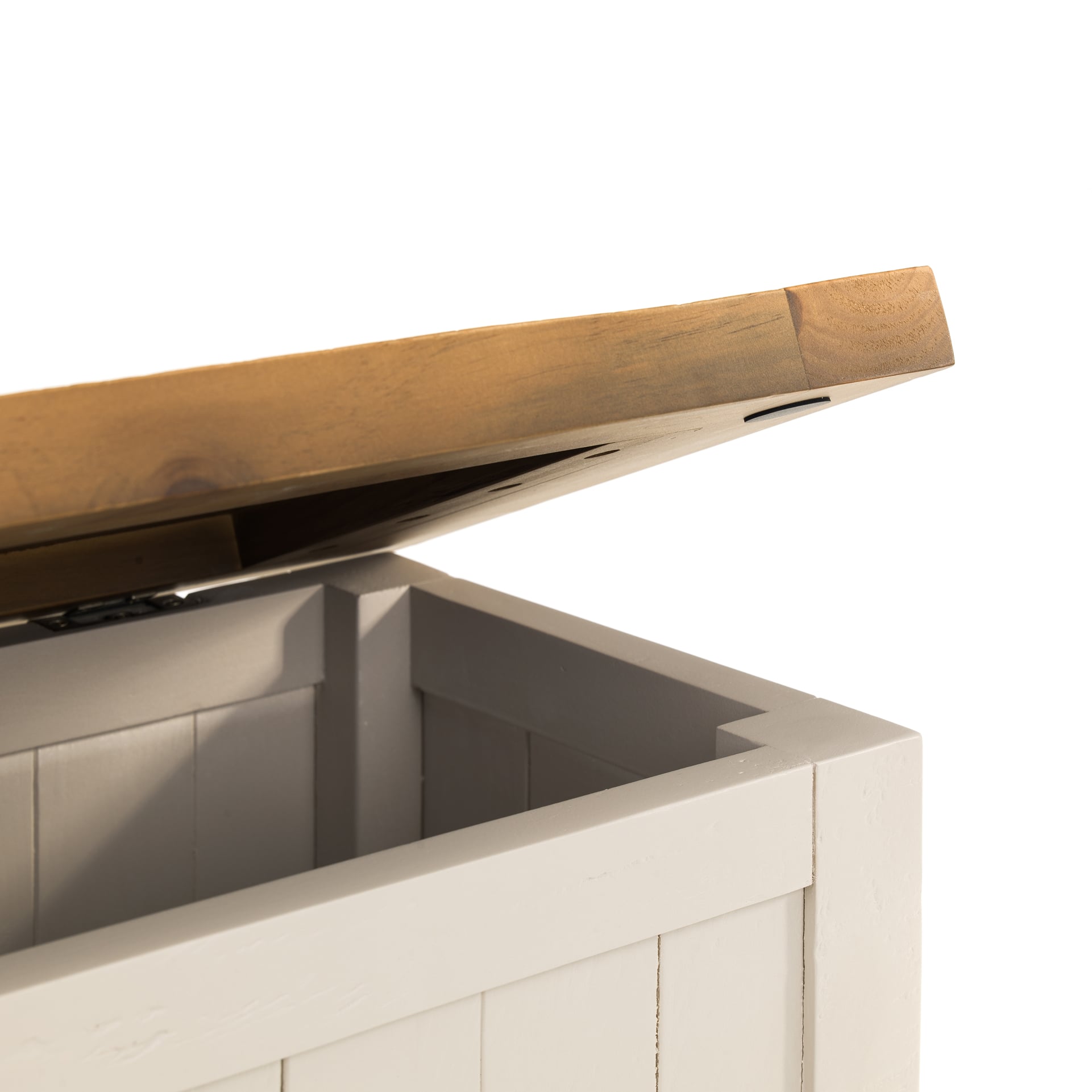 Close look on half open storage bench with details of finishes and painted surfaces