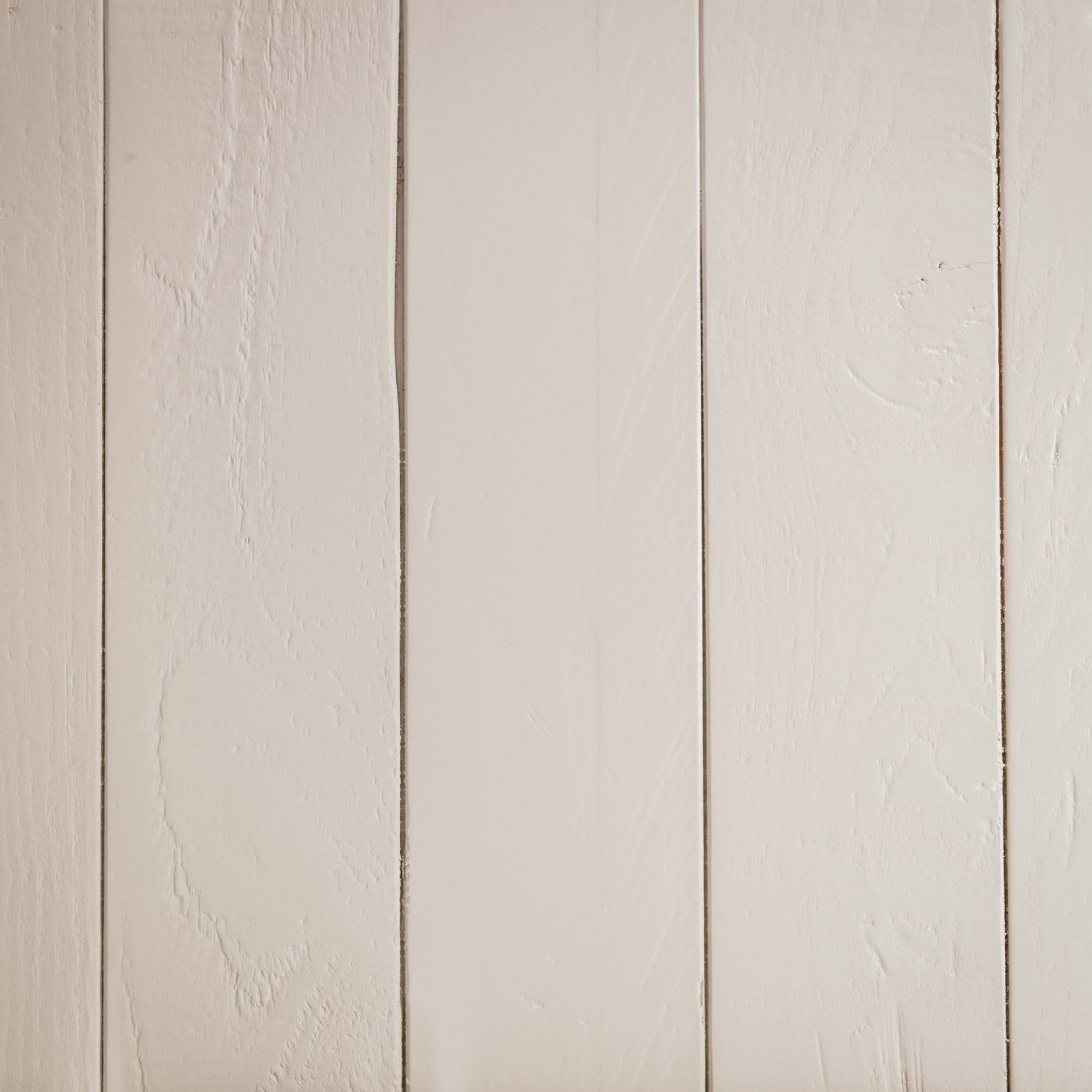 Close look on finishes of painted reclaimed pine of the sides of the bench