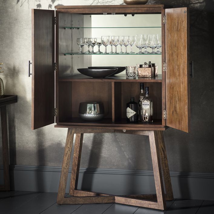Wooden 2 door cabinet shown with open doors to exhibit the storage capacity. The solid wood shelf with 2 wooden compartments provides storage for high items. The two glass shelves are adjustable in height. The cabinet is mirrored in the back. The picture is shown for Bella Noce (brown) version but the inside storage is the same for Nera collection.